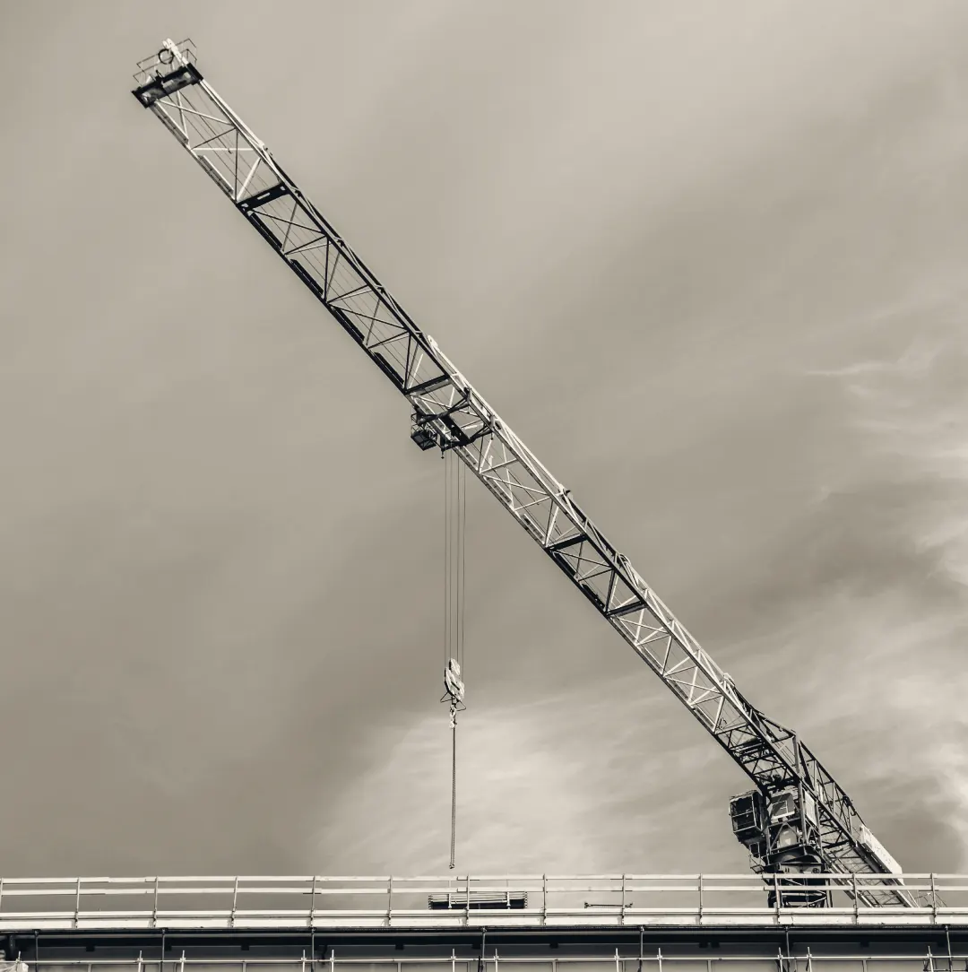 A tower crane above a building under construction
